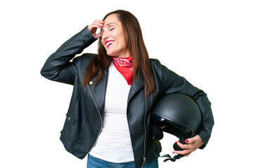 Middle age caucasian woman with a motorcycle helmet over isolated chroma key background smiling a...