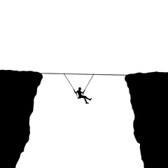 Silhouette of person on swing between two cliffs representing balance and fear  