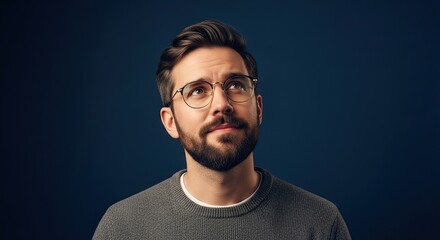 Obraz premium Bearded Man Looking Up Thinking Pensive Thoughtful Pose With Glasses
