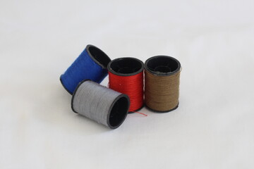 spools of thread on a white background