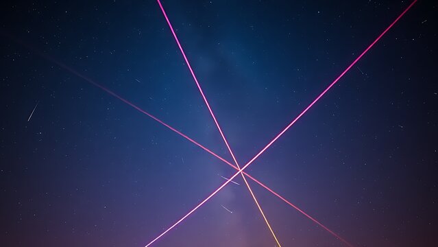 Double-exposure night sky with intersecting vibrant meteor trails, representing celestial events.