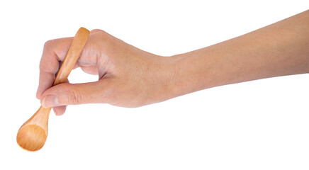 Close up image of female hand holding wooden spoon, perfect for promotional materials or food...
