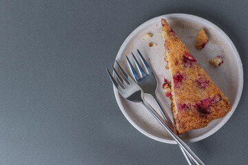 Raspberry Almond Cake Slice on Plate with Forks on Gray Background - Minimalist Dessert Presentation