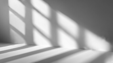 窓枠の光と影が織りなす白い壁の抽象空間