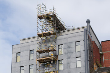 External lift hoist at modern high rise flats being constructed