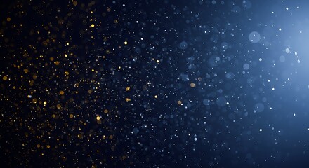 Golden and blue particles sparkle and glow against a dark background