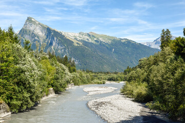 Glacial river winds through a dramatic mountain landscape