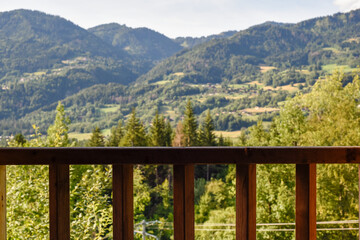 View of a forest on the mountains through a window