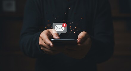 A man is holding a smartphone with an email notification icon floating above the screen, indicating a new message