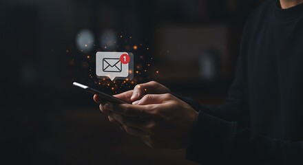 A person is holding a smartphone with an email notification popping up, indicating a new message received on their mobile device