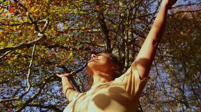 Woman enjoying autumn hike in Gorbea Natural Park