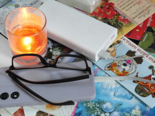 Cozy Still Life with Candlelight, Glasses and Holiday Cards
