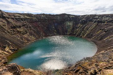 Lake at bottom of Kerid crater in Iceland stock picture