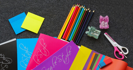 Colored notebook, colored pencils and other learning tools