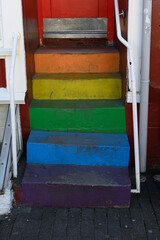 Small staircase painted in rainbow colors in Reykjavik Iceland