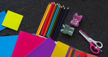 Colored notebook, colored pencils and other learning tools