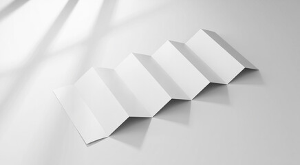 Minimalist accordion folded paper on a light gray background with shadow overlay