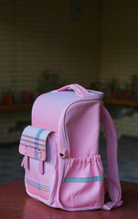 Pink children's backpack on the table