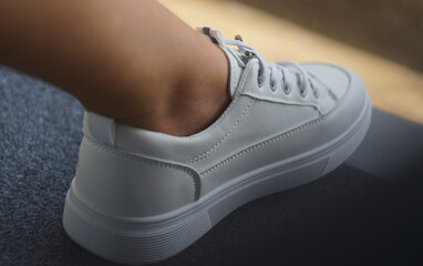 White sneakers on feet