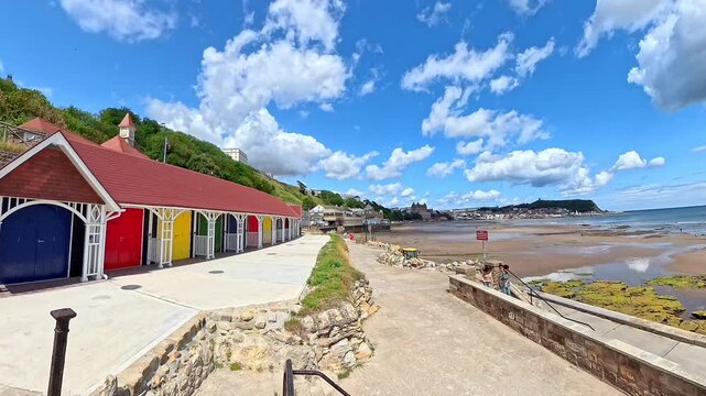 View down the promenade in Scarborough's South Bay on a bright and sunny summer day. Pull back shot