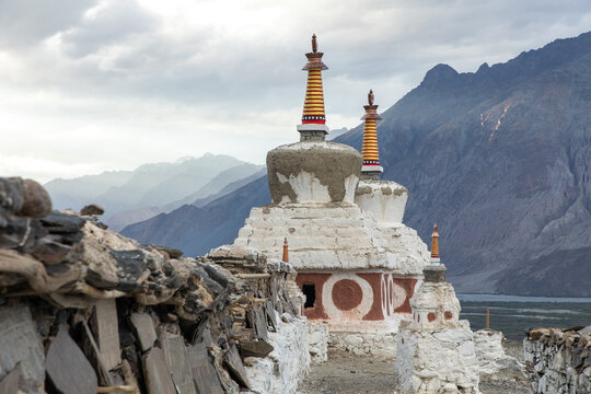 Ancient stupas in Diskit, Nubra Valley under cloudy skies
