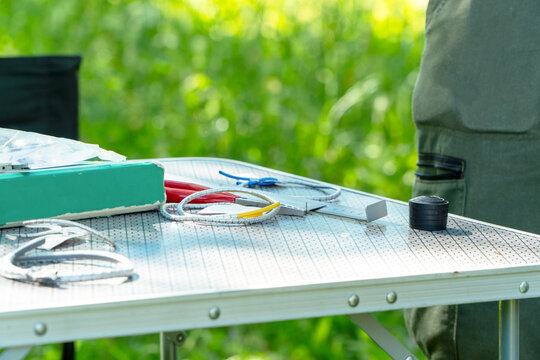 Scientific bird ringing tools on a research station table