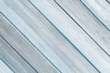 Obraz premium Light spruce wood planks arranged diagonally with frosty blue tones and minimal shadows