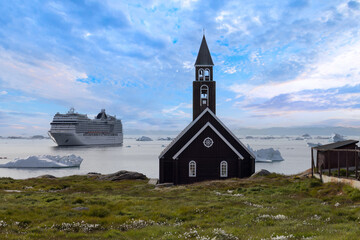 Typical architecture of Greenland Ilulissat with colored houses located near fjords and icebergs.