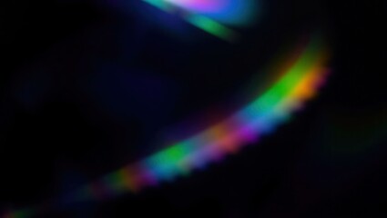 Blurred rainbow refraction overlay effect. Light lens prism effect on black background. Holographic reflection, crystal flare leak shadow overlay. Colorful rainbow disco ball light