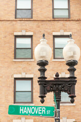 Hanover street sign on the street lamp in historic North End neighborhood of Boston, Massachusetts