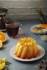 A sweet citrus cake served with oranges and lemons