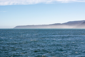 Serene Ocean View with Misty Coastline