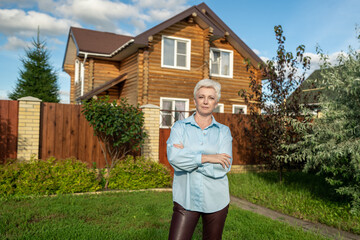 A Woman Standing at the Entrance of Her Home in a Beautiful and Picturesque Neighborhood