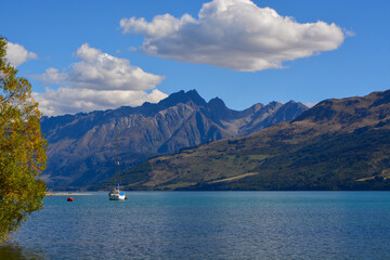 Serene Lake with Majestic Mountains and Boat