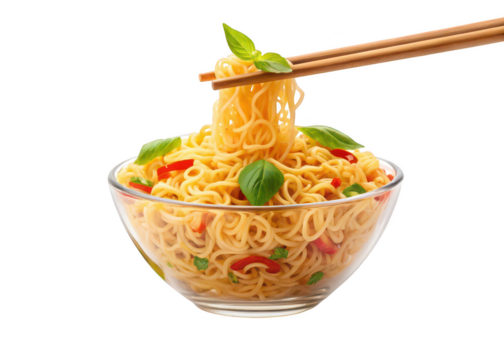 Close up studio shot of ramen noodles in glass bowl with chopsticks and basil food asian