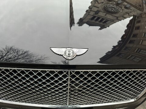Geneva, Switzerland -- Jan, 12, 2023: Bentley car badge. Bentley Motors Limited is a British designer, manufacturer and marketer of luxury cars and SUVs. Headquartered in Crewe, England.