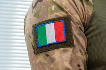 Fototapeta premium Modern military uniform with camouflage and Italian flag.