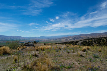 Panoramic Landscape with Rolling Hills and Blue Sky