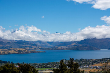 Scenic Lake View with Mountains and Clouds