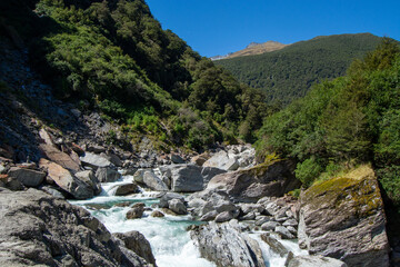 Scenic River Flowing Through Rocky Landscape