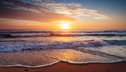 Obraz premium sunrise over the ocean with waves on the beach