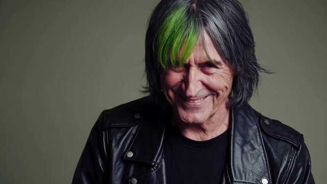 Middle-aged man with green-streaked punk hairstyle