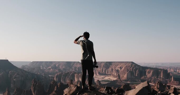 Man overlooking a canyon in Al Ula KSA