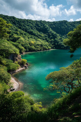 A scenic photograph capturing the emerald-green waters of Laguna de Apoyo surrounded by cliffs and lush vegetation.