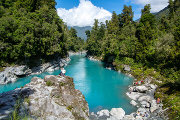 Turquoise River Surrounded by Lush Forests