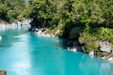 Turquoise River in Lush Green Landscape