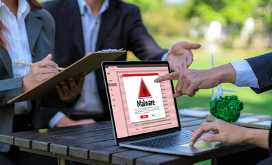 Cyber attacking concept. Malware alert showing on computer screen display scam and threat detection...