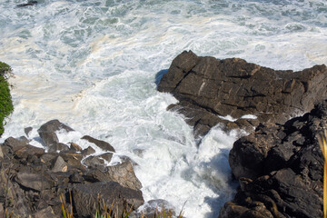 Crashing Waves Against Rocky Coastline