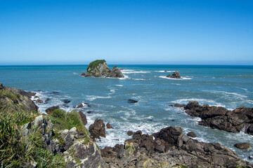 Scenic Coastal View with Rocky Shoreline and Islands