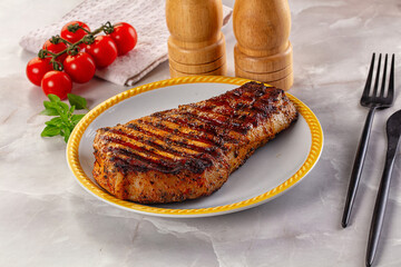 Grilled pork steak with bone